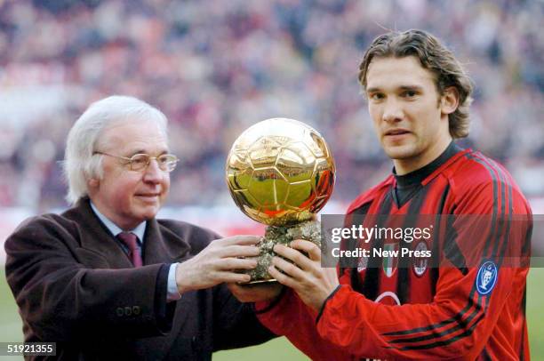 Andrei Shevchenko of AC Milan is presented with the trophy after winning the European Golden Ball award 2004 before the Serie A Match between Milan...