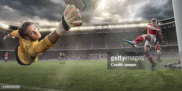 fußball goalkeeper - scoring a goal stock-fotos und bilder