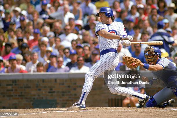 Ryne Sandberg of the Chicago Cubs swings at the ball during a game against the Los Angeles Dodgers in 1987 at Wrigley Field in Chicago, Illinois.