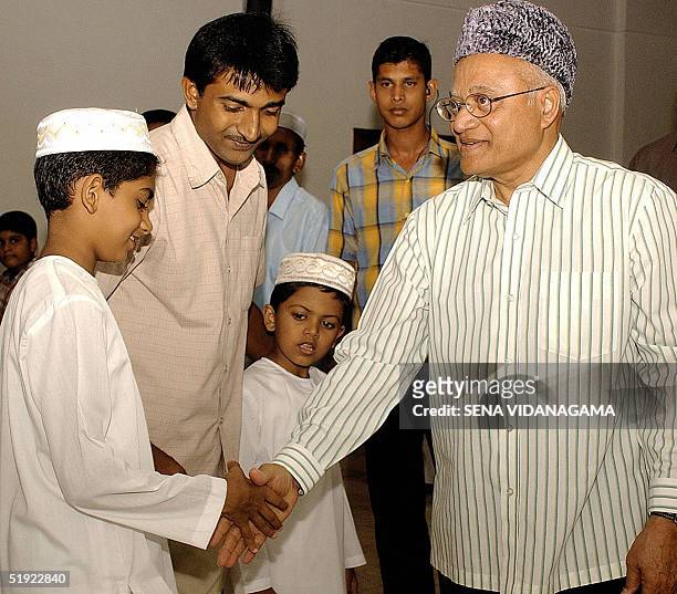 Maldivian President Maumoon Abdul Gayoom shakes hands with wellwishers at a mosque in Male, 07 January 2005, after Friday Prayers. Gayoom has...