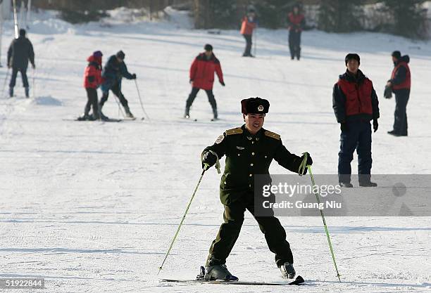 Chinese policeman learns to ski at a skiing resort on January 7, 2005 in Harbin, China. Local authorities are preparing to bid for the 2014 Winter...