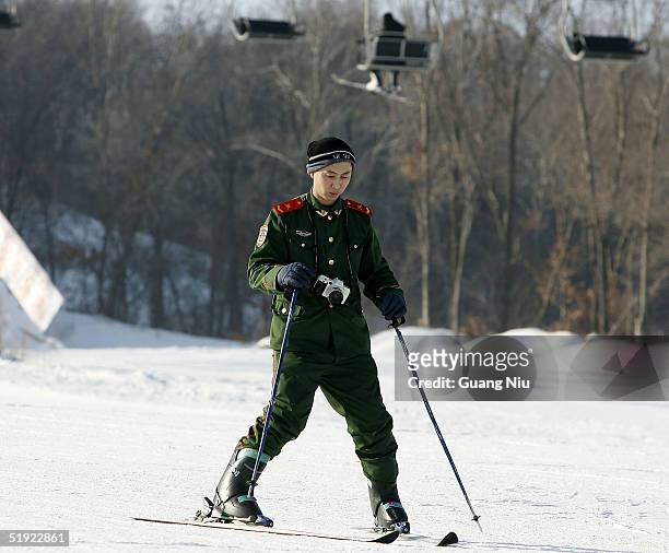 Chinese policeman learns to ski at a skiing resort on January 7, 2005 in Harbin, China. Local authorities are preparing to bid for the 2014 Winter...