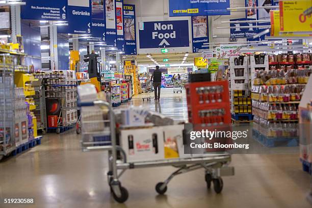 Non food sign hangs above aisles inside a Metro AG Cash & Carry wholesale store in Duesseldorf, Germany, on Tuesday, April 5, 2016. German retailer...