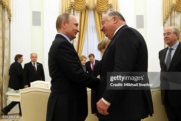 Russian President Vladimir Putin greets French Senate President Gerard Larcher during their meeting in the Kremlin on April 5, 2016 in Moscow,...