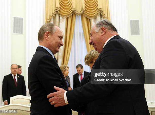 Russian President Vladimir Putin greets French Senate President Gerard Larcher during their meeting in the Kremlin on April 5, 2016 in Moscow,...