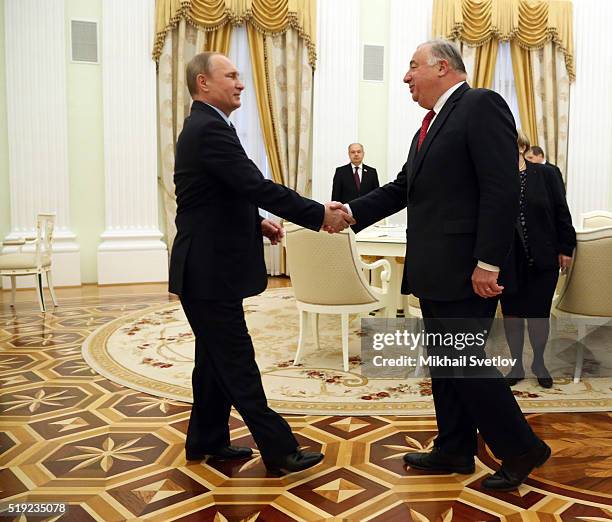 Russian President Vladimir Putin greets French Senate President Gerard Larcher during their meeting in the Kremlin on April 5, 2016 in Moscow,...