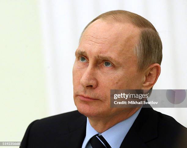 Russian President Vladimir Putin attends a meeting with French Senate President Gerard Larcher in the Kremlin on April 5, 2016 in Moscow, Russia....