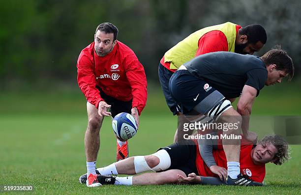 Neil de Kock of Saracens releases a pass during a training session ahead of the Champions Cup Quarter Final against Northampton Saints at Saracens...