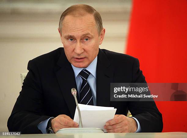 Russian President Vladimir Putin speaks during the meeting of the Victory committee on preparations for upcoming Victory Day in WWII, in the Grand...