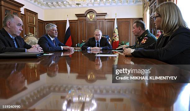 Russian President Vladimir Putin meets with Interior Minister Vladimir Kolokoltsev , Russia's Drug Control Service Chief Viktor Ivanov , Interior...