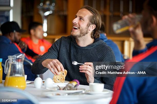 Jonas Olsson of West Bromwich Albion enjoys his breakfast before the West Bromwich Albion Training Session at The Hawthorns on April 5, 2016 in West...