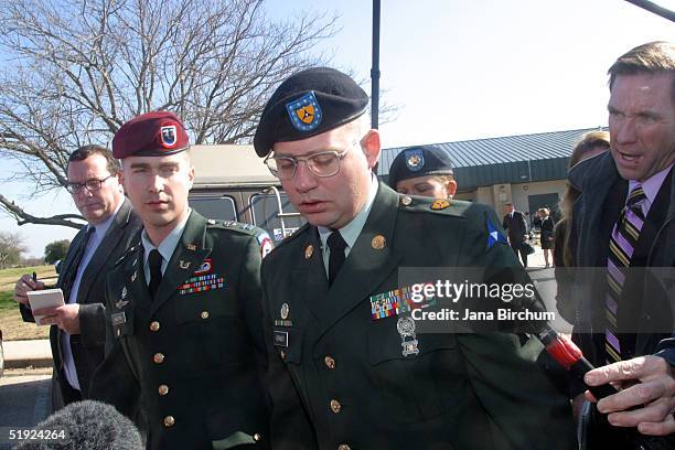 Defense counsel member Capt. Jay Heath of the U.S. Army Trial Defense Service walks with Specialist Charles A. Graner, Jr. After jury selection in...