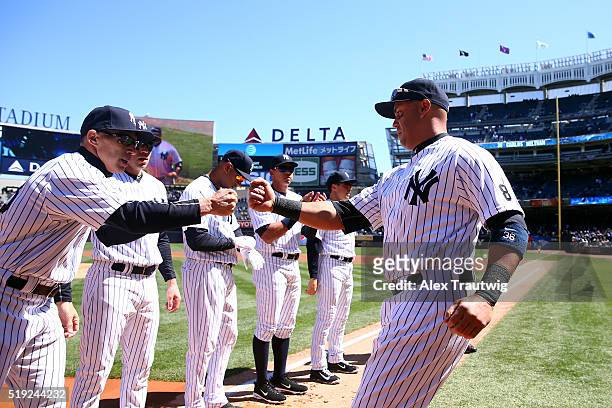 Carlos Beltran greets manager Joe Girardi of the New York Yankees prior to the game against the Houston Astros at Yankee Stadium on Tuesday, April 5,...