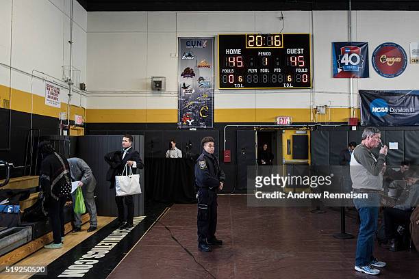 Campus police officer keeps watch before Democratic presidential candidate Hillary Clinton hosts a Women for Hillary Town Hall meeting with New York...