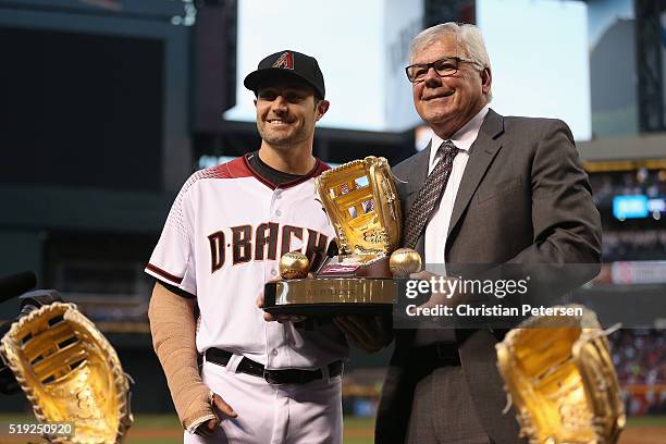 Pollock of the Arizona Diamondbacks poses with the Rawlings Gold Glove Award before the MLB opening day game against the Colorado Rockies at Chase...