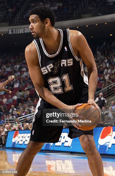 Tim Duncan of the San Antonio Spurs controls the ball during the game against the Orlando Magic at TD Waterhouse Centre on December 22, 2004 in...