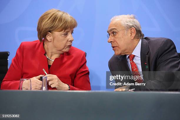 German Chancellor Angela Merkel , and Angel Gurria, general secretary of the Organisation for Economic Cooperation and Development , attend a press...