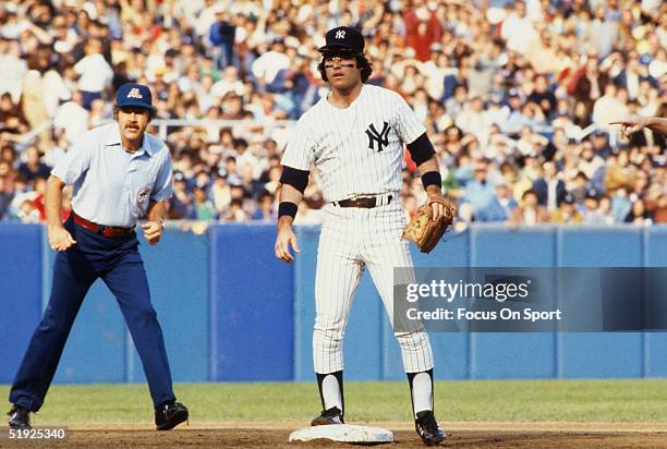 Short stop Bucky Dent of the New York Yankees stands on base during a game at Yankee Stadium circa 1978 in Bronx, New York.