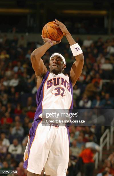 Amare Stoudemire of the Phoenix Suns shoots against the Orlando Magic during the game on December 13, 2004 at America West Arena in Phoenix, Arizona....