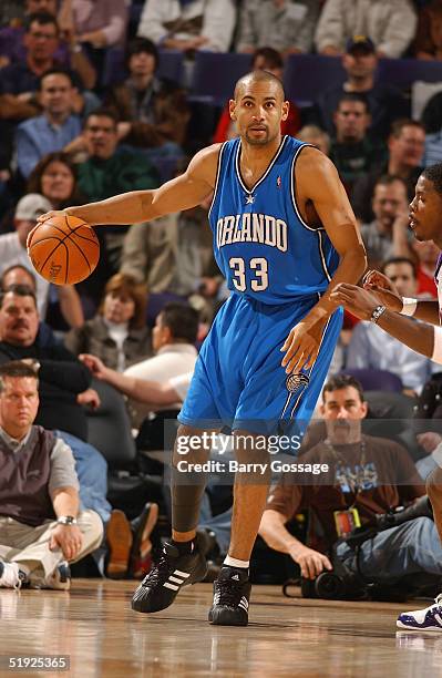 Grant Hill of the Orlando Magic moves the ball against the Phoenix Suns during the game on December 13, 2004 at America West Arena in Phoenix,...