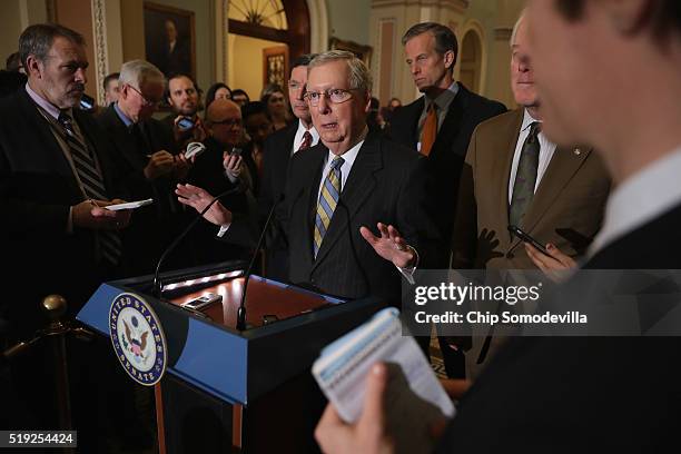 Senate Majority Leader Mitch McConnell and fellow Republican senators talk to reporters following their weekly policy luncheon at the U.S. Capitol...