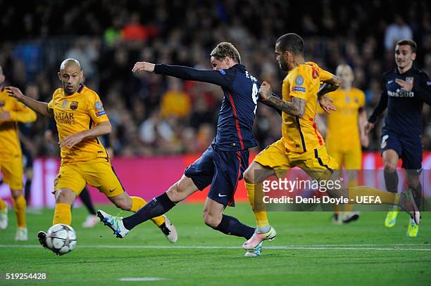 Fernando Torres of Club Atletico de Madrid scores his team's opening goal during the UEFA Champions League Quarter Final First Leg match between FC...