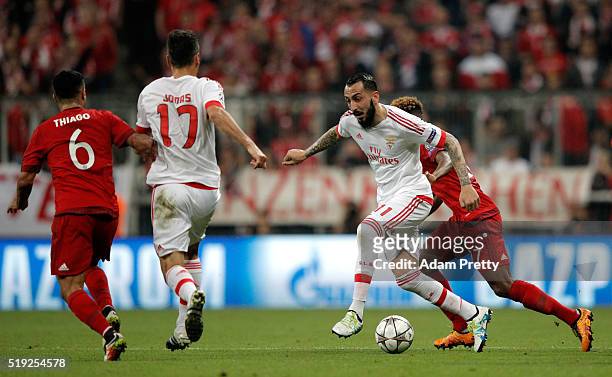 Kostas Mitroglou of Benfica evades David Alaba of Bayern Munich during the UEFA Champions League quarter final first leg match between FC Bayern...
