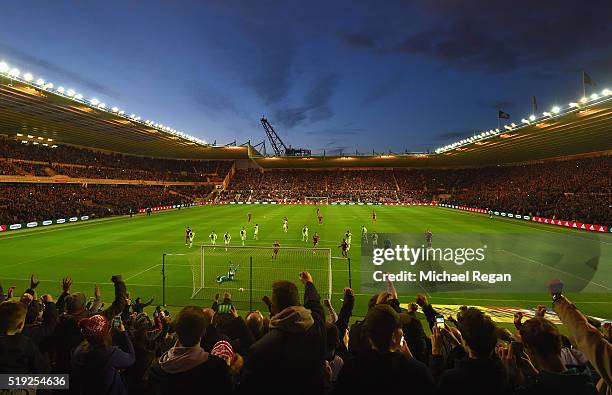 Grant Leadbitter of Middlesbrough scores the first goal from the penalty spot as fans celebrate during the Sky Bet Championship match between...