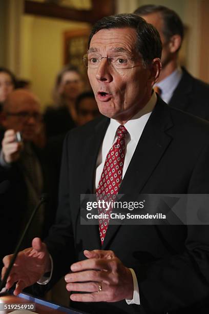 Sen. John Barrasso joins fellow Republican senators to talk with reporters following their weekly policy luncheon at the U.S. Capitol April 5, 2016...