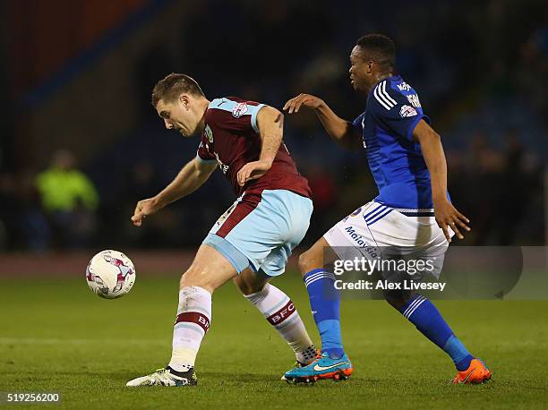 Sam Vokes of Burnley controls the ball ahead of Kagisho Dikgacoi of Cardiff City during the Sky Bet Championship match between Burnley and Cardiff...
