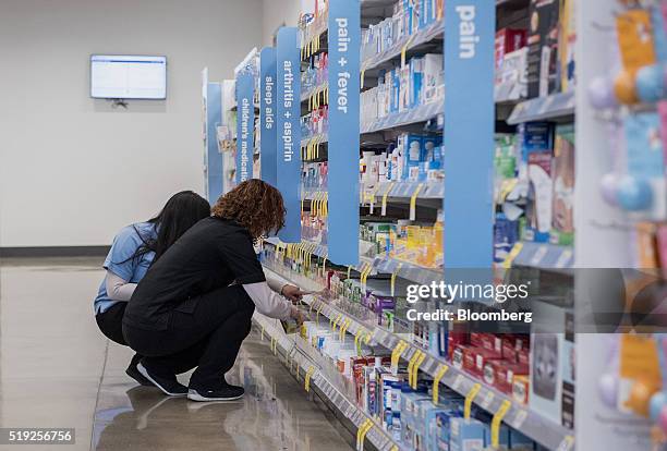 Employees stock shelves at a Walgreens Boots Alliance Inc. Store in Elmwood Park, Illinois, U.S., on Tuesday, April 5, 2016. Walgreens Boots Alliance...