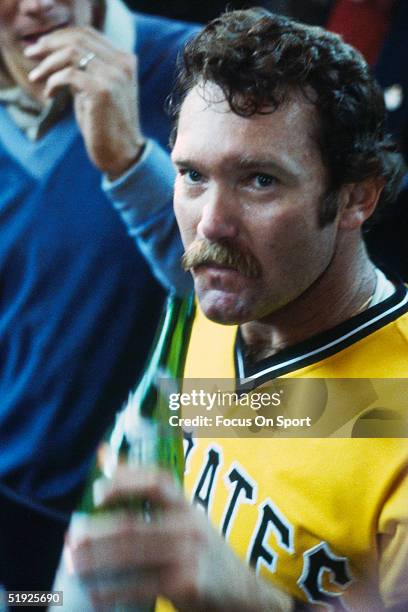 Pittsburgh Pirates' pitcher Jim Rooker drinks in the clubhouse after defeating the Baltimore Orioles for the World Series at Memorial Stadium on...