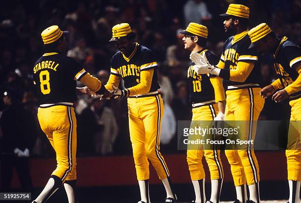 Pittsburgh Pirates' Omar Moreno greets Willie Stargell as teammates look onward during player introductions for the World Series against the...