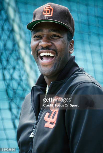 San Diego Padres' outfielder Joe Carter laughs at the camera during a game against the Chicago Cubs at Wrigley Field circa 1990's in Chicago,...