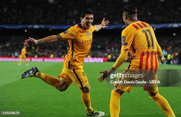 Luis Suarez of FC Barcelona celebrates with Neymar after scoring his team's 2nd goal during the UEFA Champions League Quarter Final First Leg match...