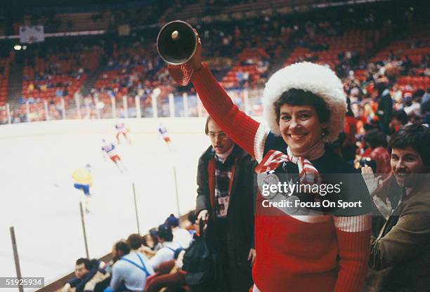 Team USA hockey fan rings a bell in the stands during the Winter Olympics during the group match featuring the United States and Sweden on February...