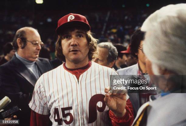 Philadelphia Phillies' pitcher Tug McGraw walks through a crowd on the field during the World Series against the Kansas City Royals at Veterans...