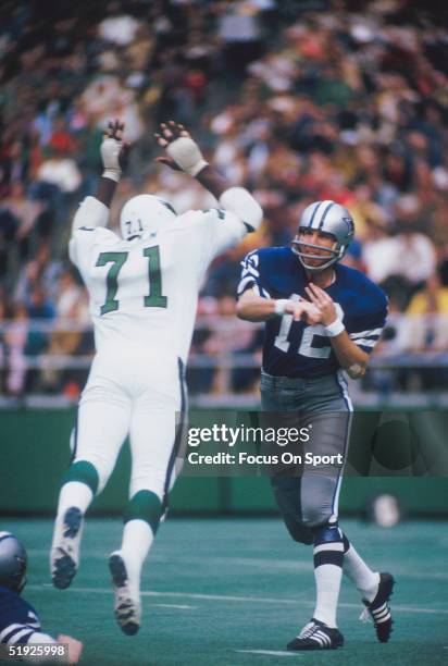 Dallas Cowboys' quarterback Roger Staubach throws a pass against the Philadelphia Eagles during a game at Veterans Stadium circa 1980's in...