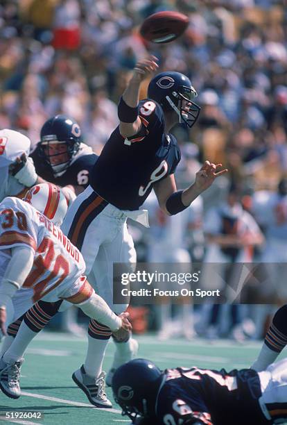 Chicago Bears' quarterback Jim McMahon throws a pass while under pressure from Tampa Bay Buccaneers.