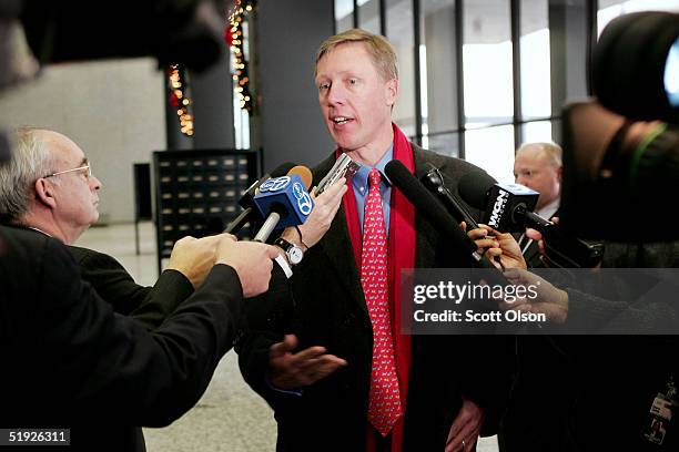 Jake Brace, Chief Financial Officer of UAL, speaks with reporters during a break in the company's bankruptcy hearing at the Federal Building January...