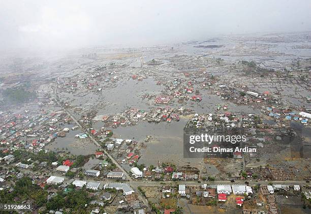 An aerial shot taken from a US Navy Seahawk helicopter from carrier USS Abraham Lincoln shows devastation caused by the Indian Ocean tsunami to the...