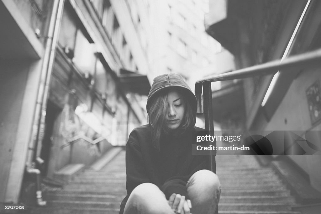 Depressed teenager at the staircase