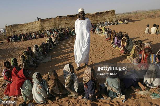 Sudanese displaced children attend a class at an outdoors makeshift school in Drage camp, on the outskirts of the southern Darfur town of Nyala, 08...