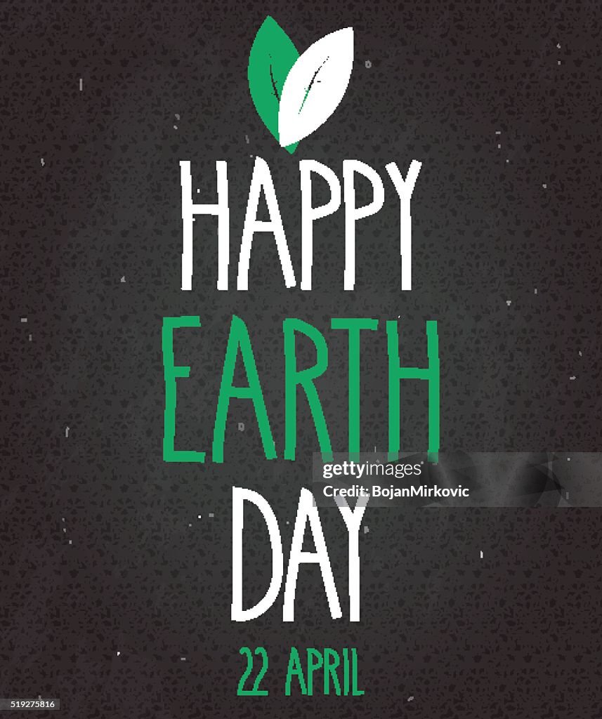 Earth Day poster on black chalkboard. Handwritten text with leafs