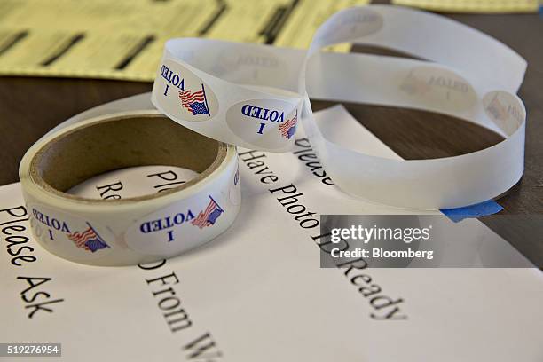 Voted" stickers sit on a table at a polling location during the presidential primary vote in Waukesha, Wisconsin, U.S., on Tuesday, April 5, 2016....