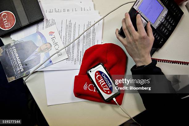 Volunteer makes phone calls at a campaign office for Senator Ted Cruz, a Republican from Texas and 2016 presidential candidate, in Waukesha,...
