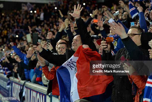 Rangers fans celebrate as Rangers beat Dumbarton 1-0 to clinch the Scottish Championship title during the match between Glasgow Rangers FC and...