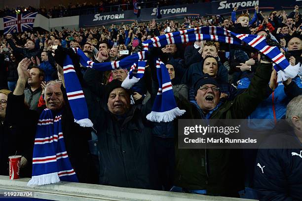 Rangers fans celebrate as Rangers beat Dumbarton 1-0 to clinch the Scottish Championship title during the match between Glasgow Rangers FC and...