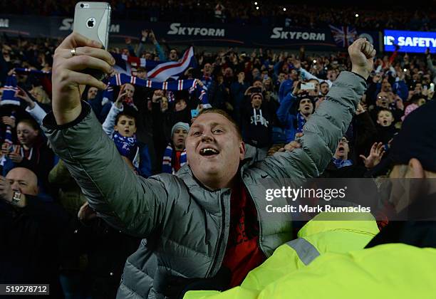 Rangers fans celebrate as Rangers beat Dumbarton 1-0 to clinch the Scottish Championship title during the match between Glasgow Rangers FC and...