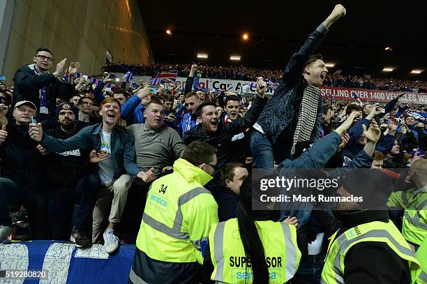 Rangers fans celebrate as Rangers beat Dumbarton 1-0 to clinch the Scottish Championship title during the match between Glasgow Rangers FC and...